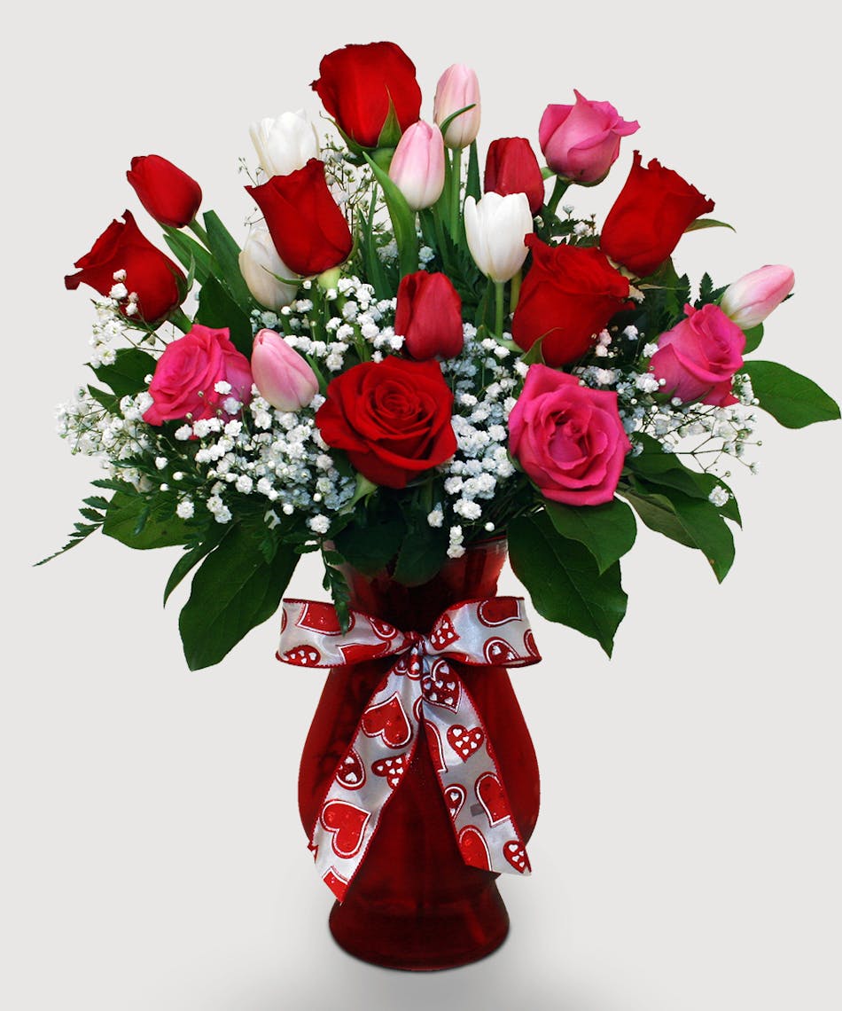 Let two lips meet this Valentine's after gifting this best-selling arrangement full of red and pink roses and tulips!