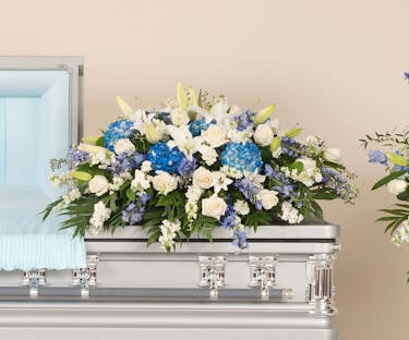 Blue And White Casket Spray Stadium Flowers